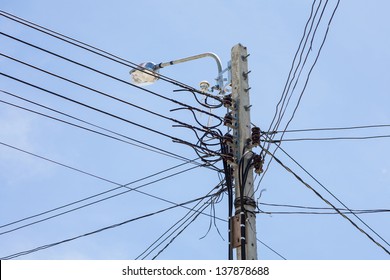 Low Voltage Electricity Post And Cable In Sunny Day