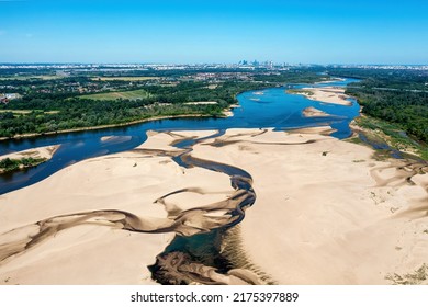 Low Water Level In Vistula River, Effect Of Drought Seen From The Bird's Eye Perspective. City Warsaw In A Distance.