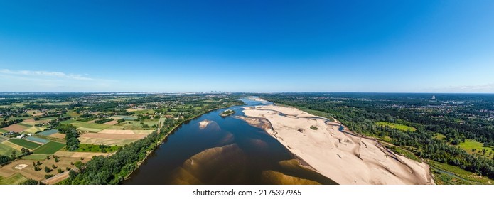 Low Water Level In Vistula River, Effect Of Drought Seen From The Bird's Eye Perspective. City Warsaw In A Distance.