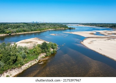 Low Water Level In Vistula River, Effect Of Drought Seen From The Bird's Eye Perspective. City Warsaw In A Distance.