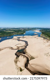 Low Water Level In Vistula River, Effect Of Drought Seen From The Bird's Eye Perspective. City Warsaw In A Distance.