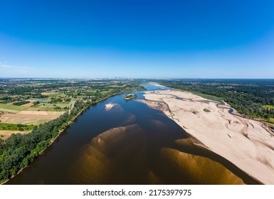 Low Water Level In Vistula River, Effect Of Drought Seen From The Bird's Eye Perspective. City Warsaw In A Distance.