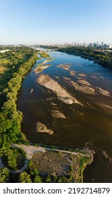 Low Water Level In Vistula River, Effect Of Drought Seen From The Bird's Eye Perspective. City Warsaw In A Distance.