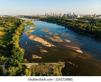 Low Water Level In Vistula River, Effect Of Drought Seen From The Bird's Eye Perspective. City Warsaw In A Distance.