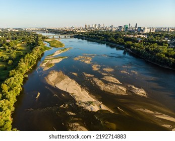 Low Water Level In Vistula River, Effect Of Drought Seen From The Bird's Eye Perspective. City Warsaw In A Distance.