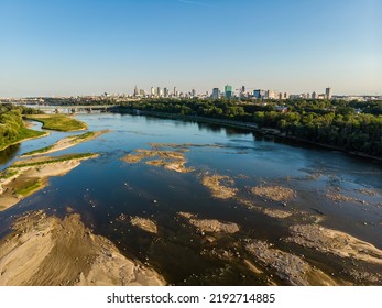 Low Water Level In Vistula River, Effect Of Drought Seen From The Bird's Eye Perspective. City Warsaw In A Distance.