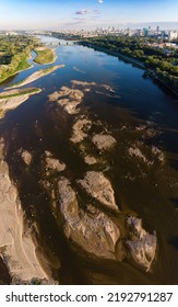 Low Water Level In Vistula River, Effect Of Drought Seen From The Bird's Eye Perspective. City Warsaw In A Distance.