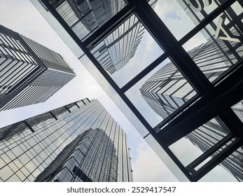 Low-angle shot capturing SCBD’s towering modern buildings against the city skyline