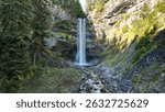 A low-angle view of Brandywine Falls in the forest in BC, Canada