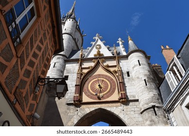 Low-angle view of the Clock Tower in old Auxerre.