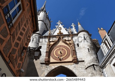 Low-angle view of the Clock Tower in old Auxerre.