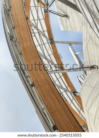 Low-angle view of the Louis Vuitton Foundation's glass and wood structure in Paris