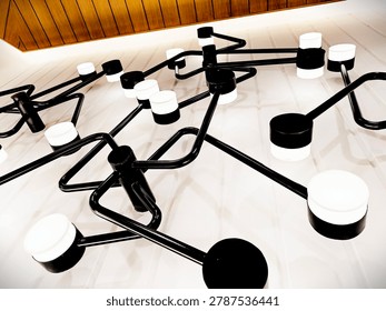 Low-angle view of a modern ceiling light fixture featuring a geometric arrangement of black metal arms and round white LED lights. The contemporary design creates a stylish and minimalist interior aesthetic, perfect for themes related to home decor, lighting design, and modern architecture.