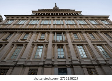Low-angle view of the Neo-classical base of Mole Antonelliana in Turin, former synagogue and symbol of the city, at dusk.