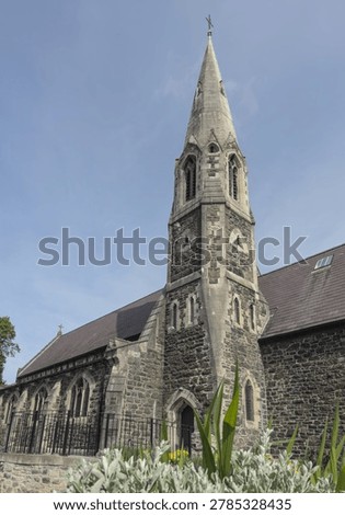 A low-angle view showcasing the historic stone exterior of Former St Mary's Church, Grade II listed Victorian Building, Bangor, Gwynedd, North Wales