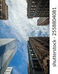 Low-Angle View of Skyscrapers from different architectural Eras in Downtown Manhattan, New York City