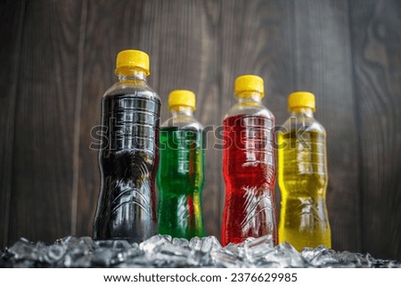 Low-angle view of Soft drink bottles Make the picture look grand or Carbonated beverages on ice, a lot of bottles of Soft drinks in colorful Chilled on ice and flavorful on the ice cubes