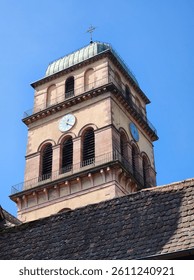 Low-angle view of a unique tower in a quaint European town