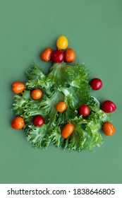 Low-calorie Diet Concept For The New Year Holidays. Christmas Tree Salat With Vegetables
Salat Lettuce Leaves And Cherry Tomatoes. Baby Dish Funny Simple Table Decoration. Healthy Vitamin-Rich Dinner