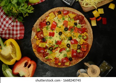 Low-Carb Keto Diet Pizza with Almond Flour Crust, Sugar-Free Tomato Sauce, Mozzarella, Bell Peppers and Olives. Served on a black background. - Powered by Shutterstock