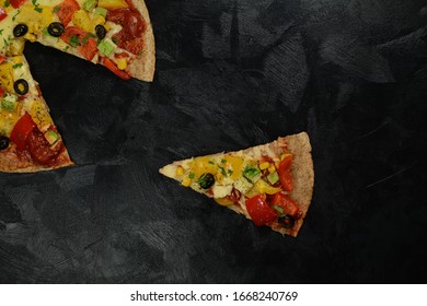 Low-Carb Keto Diet Pizza with Almond Flour Crust, Sugar-Free Tomato Sauce, Mozzarella, Bell Peppers and Olives. Served on a black background. - Powered by Shutterstock