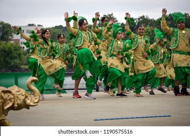 LOWELL, MASSACHUSETTS/USA - SEPTEMBER 15, 2018: A Group Of Children Performing A Traditional Bhangra Dance From Punjab Province At An Outdoor Stage During The Annual India's Heritage Festival.