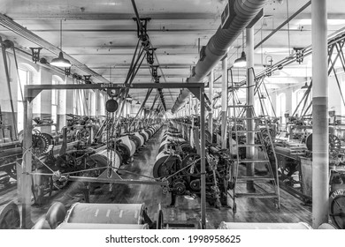 LOWELL, USA - Sep. 26, 2017: visit of the industry museum Boott cotton mills in Lowell, USA. The machine room is identical to the working conditions in the late 19th century.