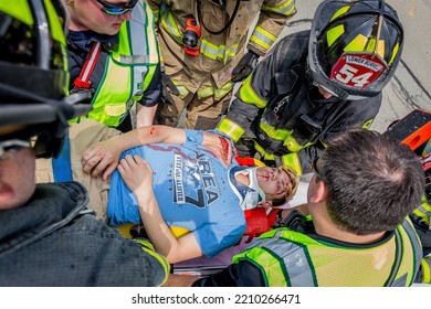 Lower Burrell, Pa., USA - May 3, 2018:  MOCK DUI TRAINING For Fire, Police, And Ems Paramedics At A Staged Car Accident With Injuries And Fatality, Parents Being Restrained