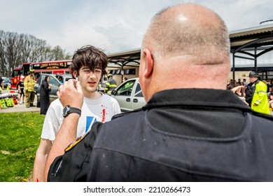 Lower Burrell, Pa., USA - May 3, 2018:  MOCK DUI TRAINING For Fire, Police, And Ems Paramedics At A Staged Car Accident With Injuries And Fatality, Parents Being Restrained