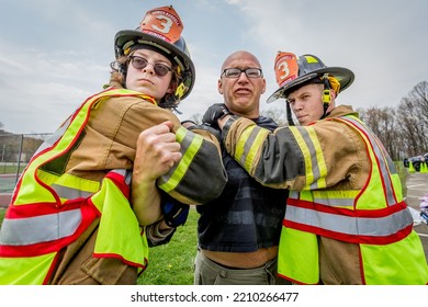 Lower Burrell, Pa., USA - May 3, 2018:  MOCK DUI TRAINING For Fire, Police, And Ems Paramedics At A Staged Car Accident With Injuries And Fatality, Parents Being Restrained