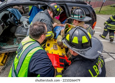 Lower Burrell, Pa., USA - May 3, 2018:  MOCK DUI TRAINING For Fire, Police, And Ems Paramedics At A Staged Car Accident With Injuries And Fatality, Parents Being Restrained