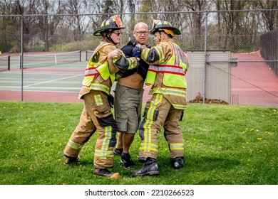 Lower Burrell, Pa., USA - May 3, 2018:  MOCK DUI TRAINING For Fire, Police, And Ems Paramedics At A Staged Car Accident With Injuries And Fatality, Parents Being Restrained