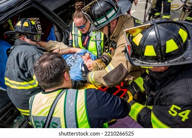 Lower Burrell, Pa., USA - May 3, 2018:  MOCK DUI TRAINING For Fire, Police, And Ems Paramedics At A Staged Car Accident With Injuries And Fatality, Parents Being Restrained