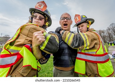 Lower Burrell, Pa., USA - May 3, 2018:  MOCK DUI TRAINING For Fire, Police, And Ems Paramedics At A Staged Car Accident With Injuries And Fatality, Parents Being Restrained