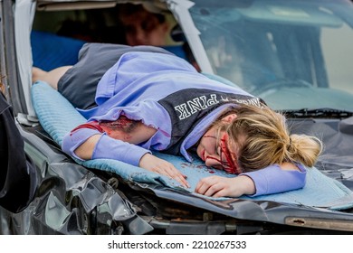 Lower Burrell, Pa., USA - May 3, 2018:  MOCK DUI TRAINING For Fire, Police, And Ems Paramedics At A Staged Car Accident With Injuries And Fatality, Parents Being Restrained