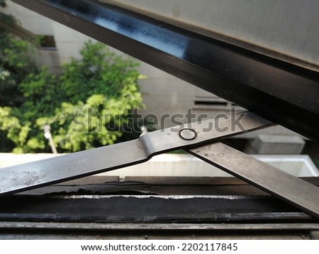 Lower casement silver window hinges.