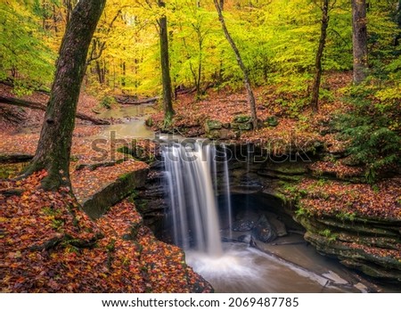 Lower Dundee Falls with peak fall foliage at the Beach City Wildlife Area. 