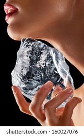 Lower Face Of A Woman Rubbing Ice Cube On Face.