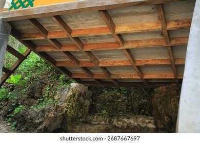the lower frame structure of a simple observation post in a coastal area made of wood