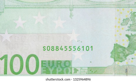 Lower left details of the green 100 Euro bill. Showing a map and a bridge image on the back
