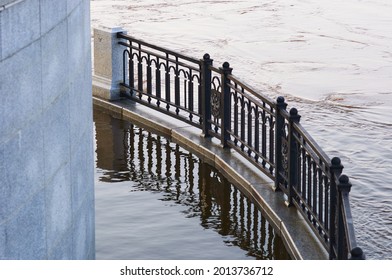 The Lower Level Of The Embankment During Seasonal Flooding. Early Summer Morning. Coat Of Arms.