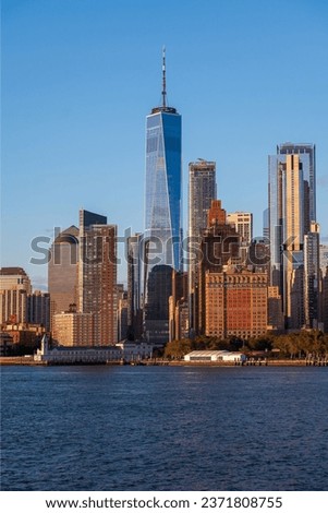 Lower manhattan  cityscape, Scenic andscape with water reflection obut New York city USA. Clear blue sky WTC is on the middle