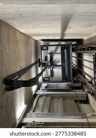 Lower part of elevator, view from below, manoeuvring cables