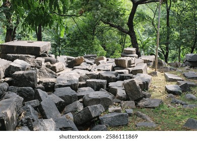 The lower part of the structure has a row of rounded, protruding shapes, which could be stylized carvings or architectural features.