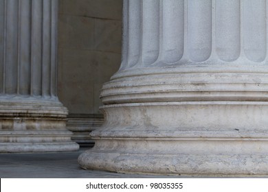 Lower parts of two pillars in front of the Austrian Parliament symbolizing strength and the foundation of democracy