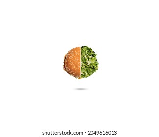 Low-fat healthy vegetables against the unhealthy burger. half burger half vegetables isolated on white background. good food concept.