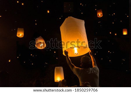 Loy Krathong Festival Balloon fire or yeepeng. Floating lantern on the Sky, flying lanterns, hot-air balloons in Chiang Mai,Thailand