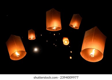 Loy Krathong Festival or Yi Peng Festival with lighted Paper Lanterns are lit to pray for good luck and happiness in the sky in Chiang Mai Thailand. The old traditions and culture of Thailand.