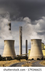 LOY YANG, VICTORIA, AUSTRALIA - MARCH 1, 2014 - Condensation cooling towers of the Loy Yang power station are seen as steam is released. Loy Yang is the largest power station in Australia.
