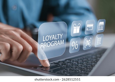 Loyalty program concept, Customer Engagement. Businessman using laptop computer with loyalty program icon on virtual screen.